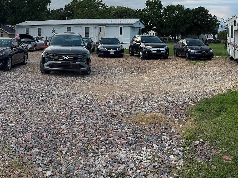 Trucks and SUVs on the PS Auto Solutions lot in Katy, TX